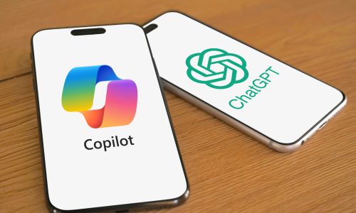 Microsoft Copilot and ChatGPT logos are displayed on two smartphones next to each other, digital assistant, chatbot, LLM, GPT, artificial intelligence, AI, 2024