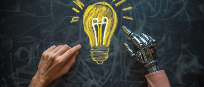 A human and a humanoid AI agent robot have their hands next to a lightbulb chalk drawing symbolizing agentic autonomy and brainstorming ideas through collaboration with autonomous copilot bots